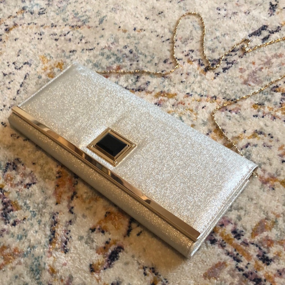 Silver metallic clutch with black & gold buckle!
